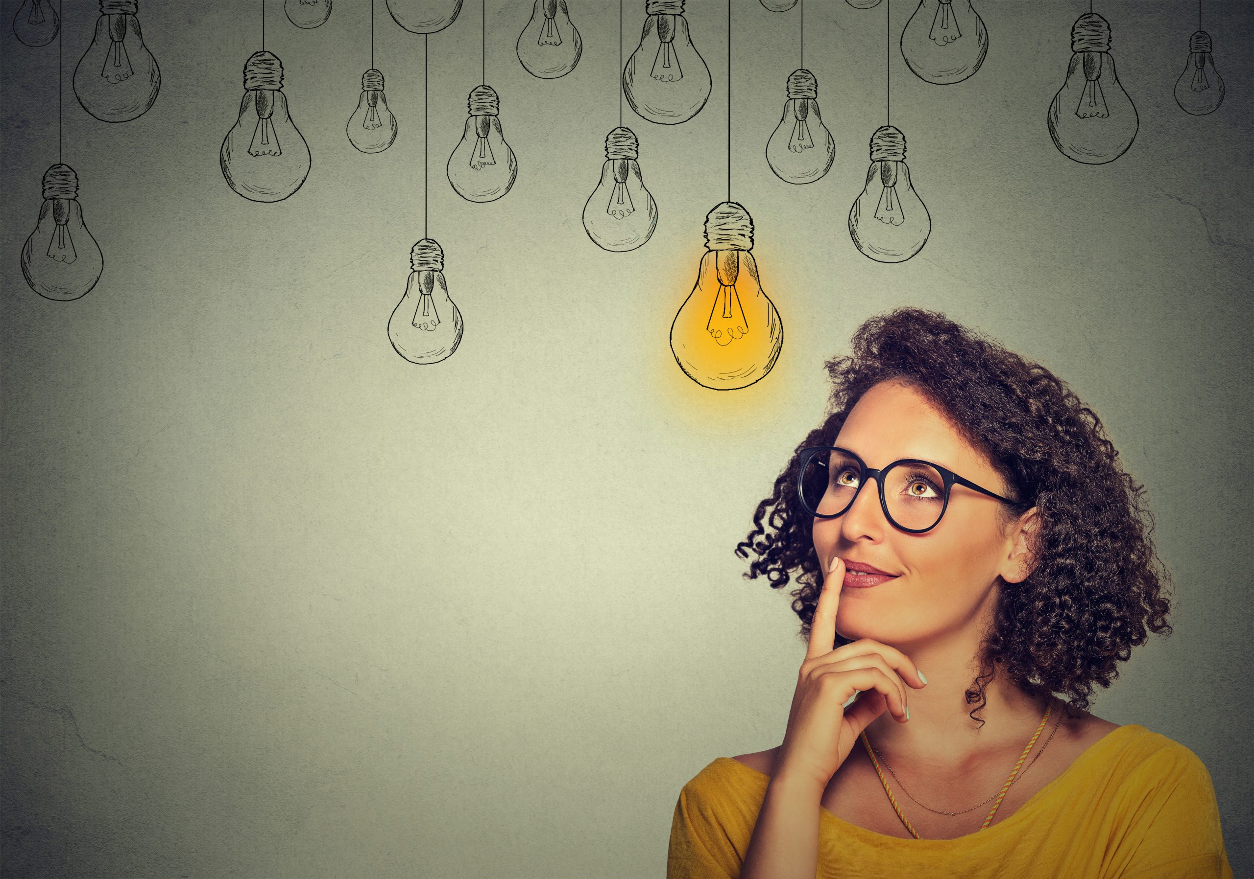 woman thinking with lightbulb above her head