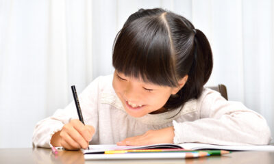 girl enjoying writing